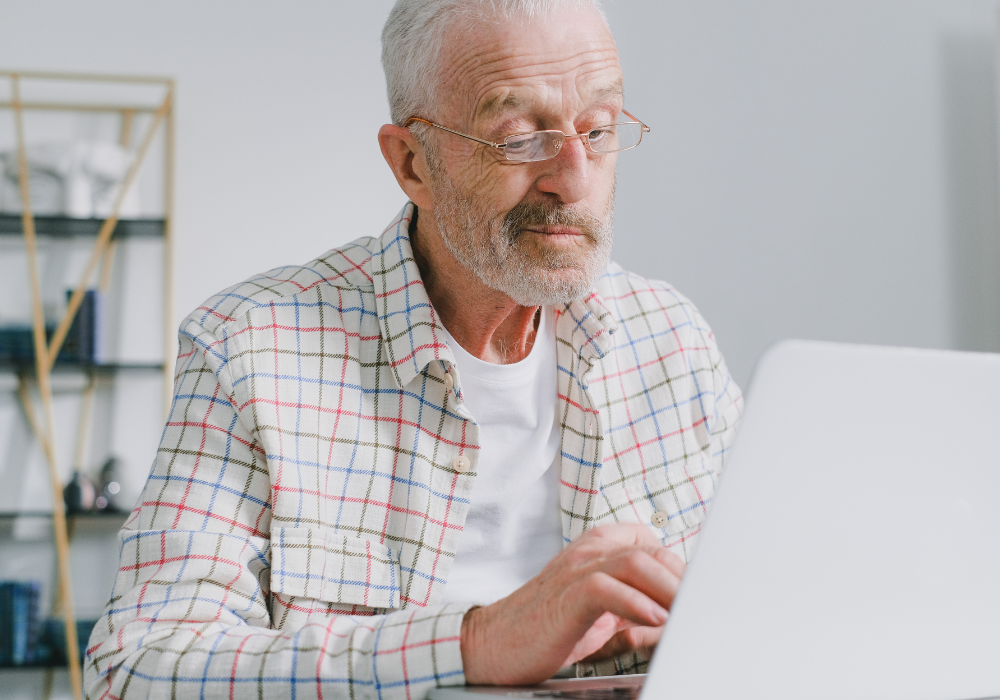 man researching dentures insurance coverage cost in Prince Frederick